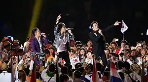 JYJ at the 2014 Asian Games opening ceremony.From left to right:  Kim Junsu, Kim Jae-joong, and Park Yoo-chun (former).