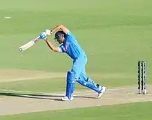 Rohit Sharma is playing a shot.