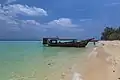 Clear water and long-tailed boat at Ko Kradan