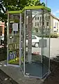 Street library, made with a telephone booth, in Giromagny, France