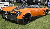 Orange with exposed carbon fiber engine cover