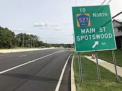 Exit signage on Route 18 southbound directing to Spotswood's Main Street