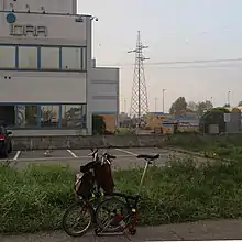 Bicycle in front of factory with Idra sign