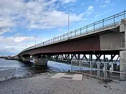 One end of the bridge photographed from the shore