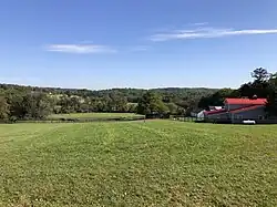 Rolling hills, forests and horse pasture in the northern portion of Hopewell Township, characterizing its mostly rural nature