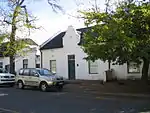 These properties were granted in 1750 to the landdrost and Heemrade, and to Jan Greyling. The complex of buildings is of special architectural interest and forms an essential part of the historic core of Stellenbosch.