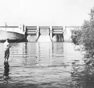 An angler fishes downstream of the Elk River Dam in the early 1960s