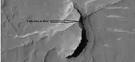 Possible fault along a butte, as seen by HiRISE under HiWish program  These may be part of linear ridge networks that are produced with impact craters.