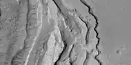 Tilted layers formed when ground collapsed, as seen by HiRISE, under HiWish program