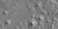 Close view of expanded craters, as seen by HiRISE After the impact, ice left the ground and made the crater larger in diameter.