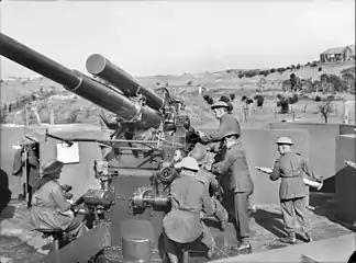 Members of the Volunteer Defence Corps training with a 3.7 inch anti-aircraft gun emplaced on Kensington golf links in Sydney.