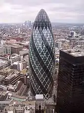 30 St Mary Axe, one of London's most popular new buildings, towers above its neighbours.