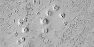 Close view of cones, as seen by HiRISE under HiWish program.  These cones probably formed when hot lava flowed over ice-rich ground.