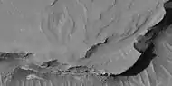 Close view of layers, as seen by HiRISE under HiWish program  At least one layer is light-toned which may indicated hydrated minerals.  Location is Arabia quadrangle.