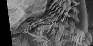 Close view of layers in Schiaparelli crater (HiRISE). Dark sand is visible on some layers.