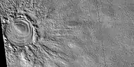 Close view of layered feature in crater, as seen by HiRISE under HiWish program  Feature seems to be higher than parts of the crater rim.