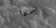 Close view of out of place rock, as seen by HiRISE under HiWish program It may be a meteorite or it may have been tossed here by a nearby impact.