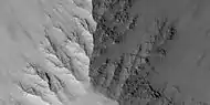 Close view of layers in Louros Valles, as seen by HiRISE under HiWish program Note this is an enlargement of a previous image.