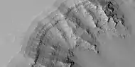 Close view of layers in the Louros Valles, as seen by HiRISE under HiWish program; this is an enlargement of a previous image.