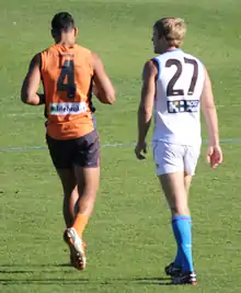 Israel Folau (left) playing for the Giants