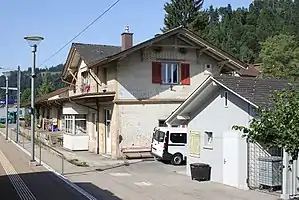 Two-story building with gabled roof