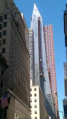 Side view of building from 54th Street, looking west with scaffolding visible