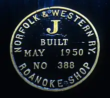 A close-up of a steam locomotive's builder's plate