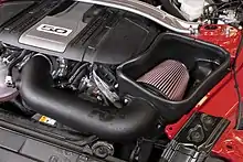 A K&N intake kit installed in an engine bay