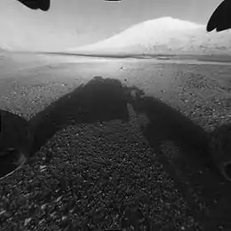 Aeolis Palus with Aeolis Mons ("Mount Sharp") as viewed by the Curiosity rover (August 6, 2012).