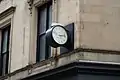 View of the clock mounted on the facade at the northeast corner