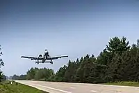 An A-10 Thunderbolt II from Davis-Monthan Air Force Base, Arizona, takes off on a public highway in Alpena, Michigan, August 5, 2021