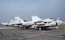 A lineup of VA-115's A-6E SWIP Intruders at NAF Atsugi in 1994.
