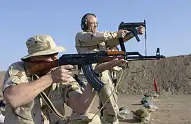 An AKM assault rifle asymmetric slant cut muzzle fixture designed to counteract muzzle rise (and muzzle climb) during (automatic) firing.