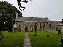 Picture of St Michael and All Angels Church, located to the west of Alnham village centre.