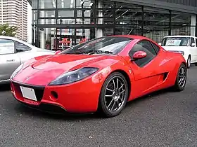 Front-three-quarter view of a two-door car with wing mirrors