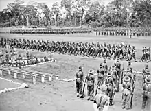 Soldiers marching around a parade ground