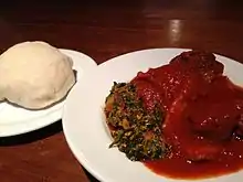 A plate of pounded yam, and egusi soup