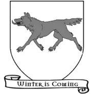 A coat of arms showing a gray wolf on a white field.