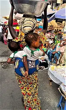 A woman selling water at Makola, Ghana