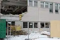Wall being torn down from the old building
