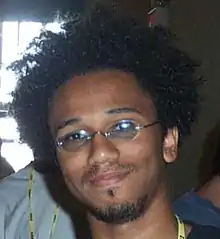 McGruder at the 2002 Hackers on Planet Earth hacker con