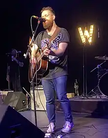 Aaron West performing in 2022