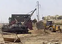 In Operation Iraqi Freedom, the M88 saw great use lifting and placing heavy concrete barriers during combat engineering missions.