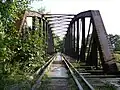 Abandoned railway bridge over Nysa Kłodzka in Otmuchów, Poland