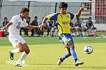 Abhishek Yadav of Mumbai FC and Samir Naik of Dempo SC during I-League match at Fatorda Stadium Goa