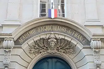 Beaux Arts cartouche with a mascaron, above the entrance door of the Académie d'Agriculture de France, Paris, unknown architect, 1878