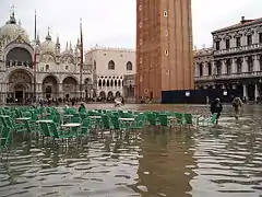 Tidal flooding. Sea-level rise increases flooding in low-lying coastal regions. Shown: Venice, Italy (2004).