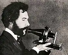 Image 23Actor portraying Alexander Graham Bell in a 1926 silent film. Shows Bell's second telephone transmitter (microphone), invented 1876 and first displayed at the Centennial Exposition, Philadelphia.  (from History of the telephone)