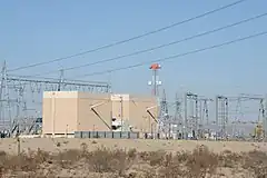 HVDC converter station with valve hall close to center of image.