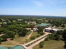 Aerial photograph of a university in Bulawayo, Zimbabwe surrounded by many trees.